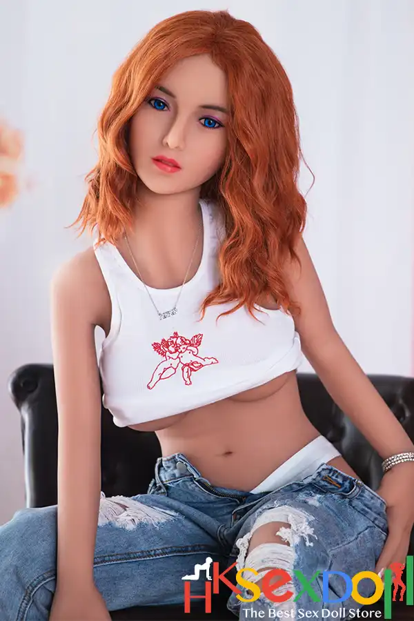 Roxy wheat skin sex doll front view with copper orange hair