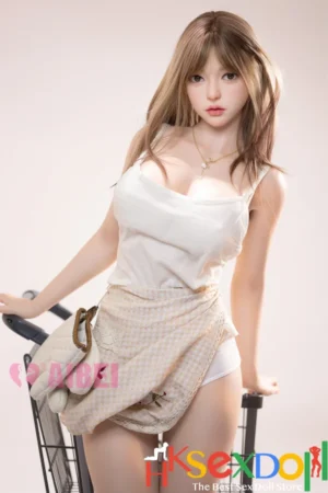 tori premium curvy tpe sex doll gray background pinkish-orange glow short skirt