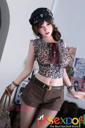 rosemary doll features a leopard print top and brown shorts, with dark brown wavy hair and a skull cap